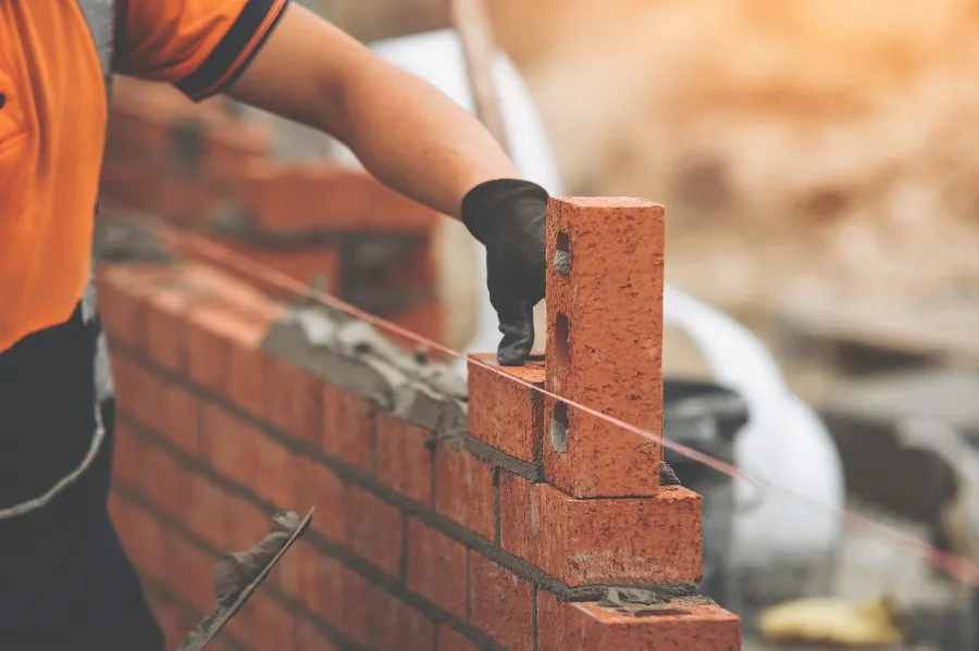 laying bricks