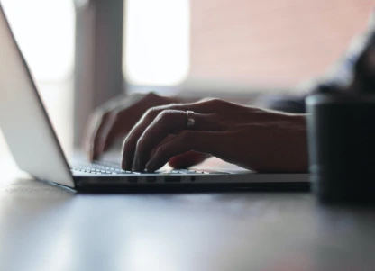 typing on laptop